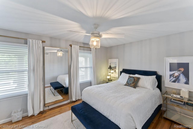 26155 Timber Trl, Dearborn Heights, MI 48127 - bedroom with wood finished floors, a ceiling fan, and baseboards