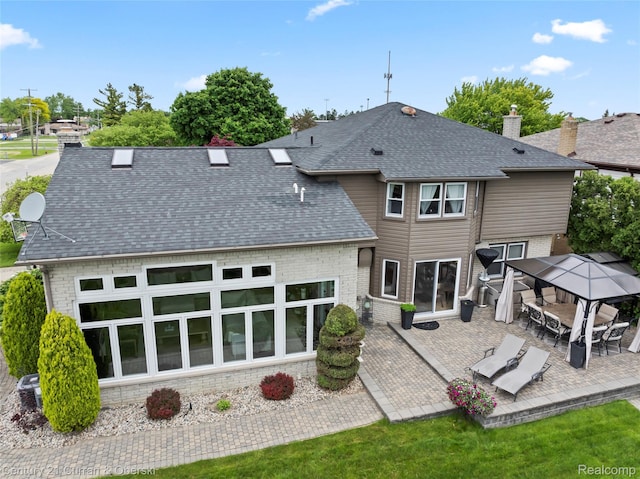 26155 Timber Trl, Dearborn Heights, MI 48127 - back of house featuring a gazebo, a patio area, and roof with shingles