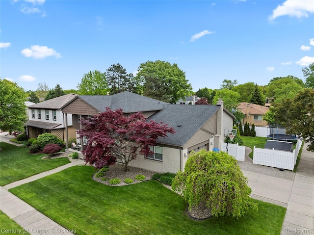 26155 Timber Trl, Dearborn Heights, MI 48127 - view of front facade with a shingled roof, a garage, brick siding, concrete driveway, and a residential view