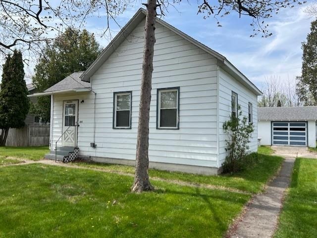 205 Evans St, East Tawas, MI 48730 - view of front facade with entry steps and driveway