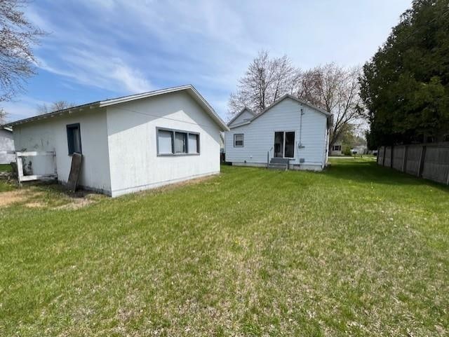 205 Evans St, East Tawas, MI 48730 - rear view of property with a lawn