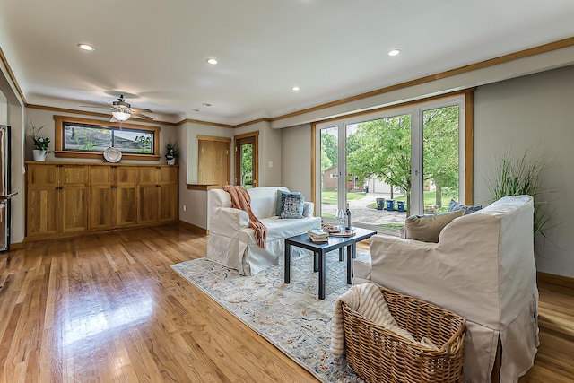 2441 Nottingham Rd, Ann Arbor, MI 48104 - living area featuring light wood finished floors, a ceiling fan, recessed lighting, baseboards, and crown molding