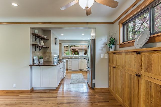 2441 Nottingham Rd, Ann Arbor, MI 48104 - kitchen with white appliances, open shelves, light wood-type flooring, tasteful backsplash, and white cabinets