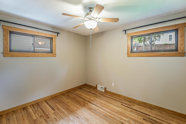 2441 Nottingham Rd, Ann Arbor, MI 48104 - unfurnished room featuring light wood-style floors, baseboards, and ceiling fan