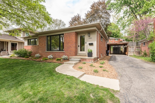 2441 Nottingham Rd, Ann Arbor, MI 48104 - view of front of house with brick siding and asphalt driveway