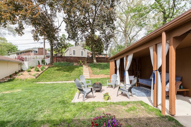 2441 Nottingham Rd, Ann Arbor, MI 48104 - view of yard featuring a fire pit and a patio area