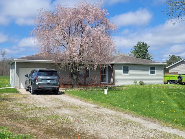 1082 Morris Rd, Lapeer, MI 48446 - ranch-style house with a garage, dirt driveway, a front lawn, a porch, and a shingled roof