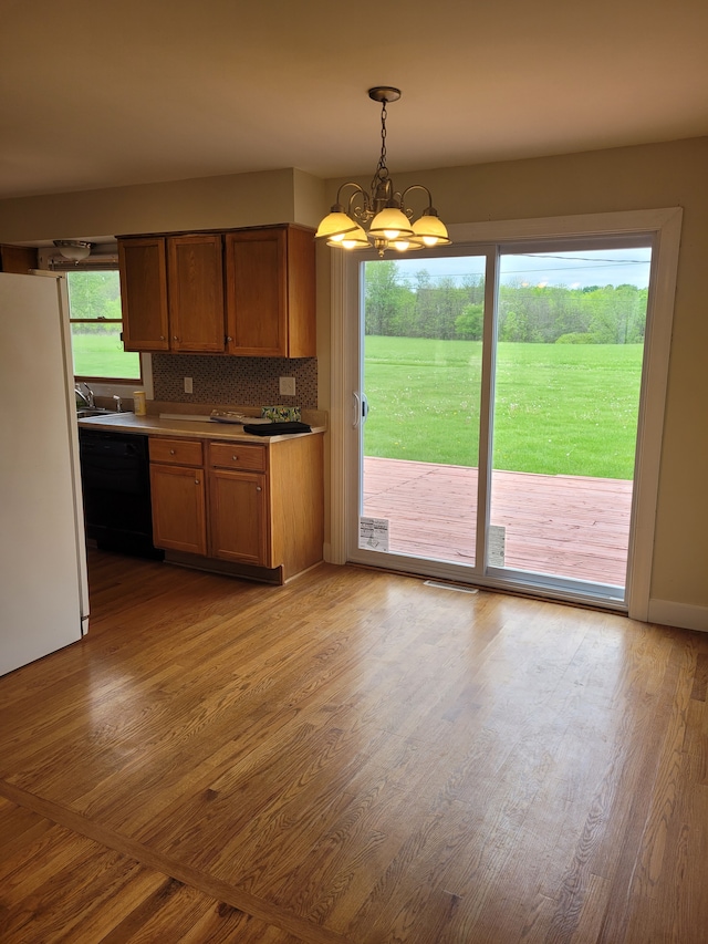 1082 Morris Rd, Lapeer, MI 48446 - kitchen with freestanding refrigerator, dishwasher, and light wood finished floors