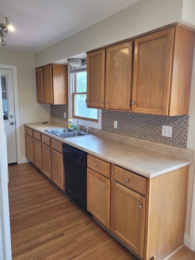 1082 Morris Rd, Lapeer, MI 48446 - kitchen featuring dishwasher, a sink, wood finished floors, tasteful backsplash, and light countertops