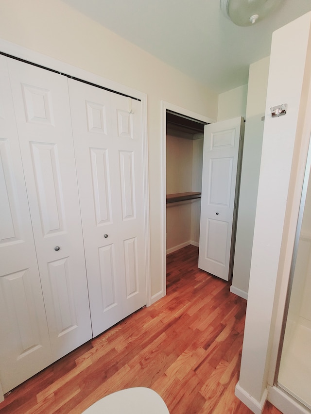 1082 Morris Rd, Lapeer, MI 48446 - unfurnished bedroom featuring light wood-style flooring and baseboards