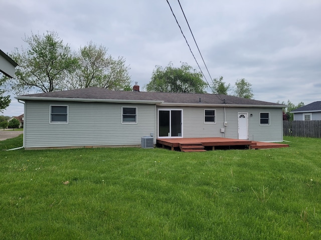 1082 Morris Rd, Lapeer, MI 48446 - rear view of house with central AC unit, a deck, and a chimney