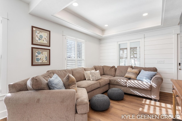 2245 Auburn Ave, Holland, MI 49424 - living room featuring wood finished floors, a tray ceiling, and recessed lighting
