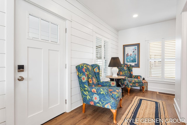 2245 Auburn Ave, Holland, MI 49424 - sitting room with wood finished floors, wooden walls, baseboards, and recessed lighting