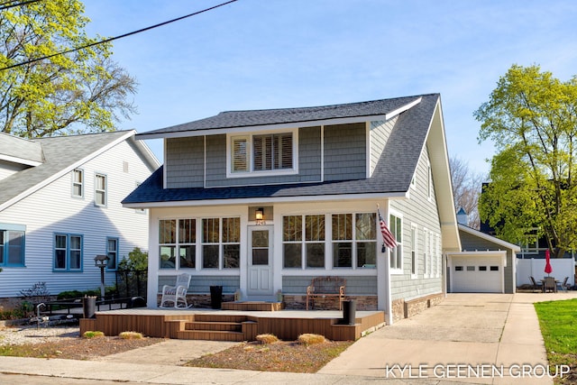 2245 Auburn Ave, Holland, MI 49424 - view of front facade with roof with shingles, concrete driveway, and a detached garage