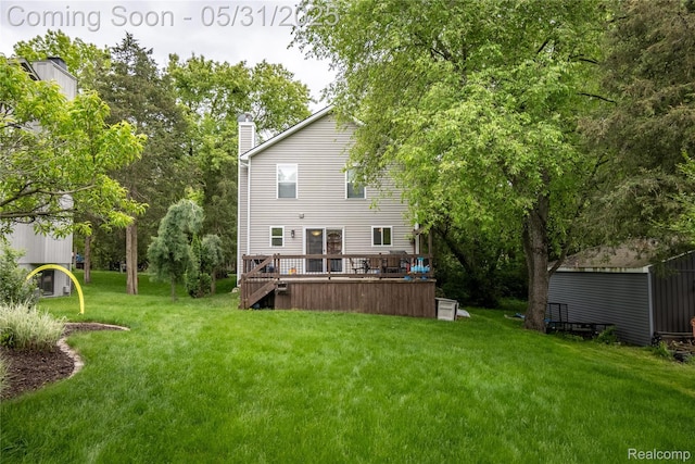 7457 Ore Lake Rd, Brighton, MI 48116 - rear view of property with a yard, a chimney, and a deck