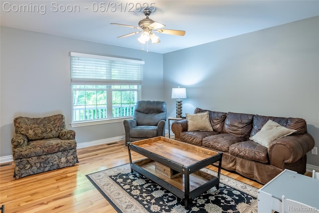 7457 Ore Lake Rd, Brighton, MI 48116 - living room featuring ceiling fan, wood finished floors, and baseboards