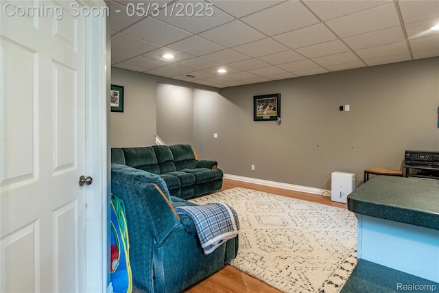 7457 Ore Lake Rd, Brighton, MI 48116 - living area with wood finished floors, recessed lighting, baseboards, and a drop ceiling