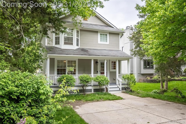 7457 Ore Lake Rd, Brighton, MI 48116 - view of front of property featuring covered porch and a front yard