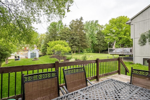 7457 Ore Lake Rd, Brighton, MI 48116 - wooden deck with a yard and view of scattered trees