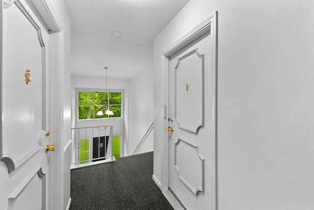 35980 Ann Arbor Trl, Livonia, MI 48150 - hallway featuring an upstairs landing, carpet, and a textured ceiling