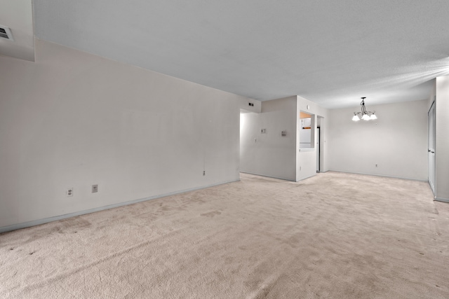 35980 Ann Arbor Trl, Livonia, MI 48150 - empty room with a chandelier, light carpet, and baseboards