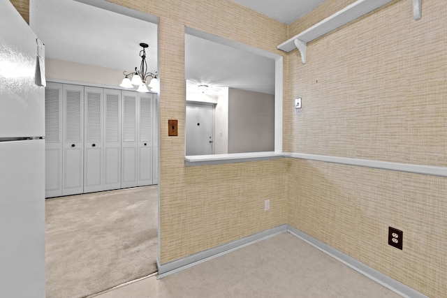 35980 Ann Arbor Trl, Livonia, MI 48150 - hallway with a chandelier and carpet flooring