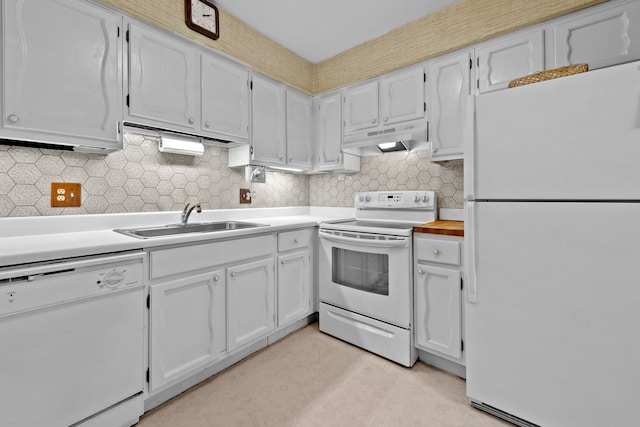 35980 Ann Arbor Trl, Livonia, MI 48150 - kitchen featuring white appliances, a sink, under cabinet range hood, tasteful backsplash, and light countertops