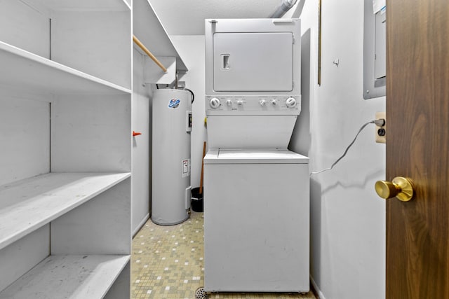 35980 Ann Arbor Trl, Livonia, MI 48150 - laundry room with water heater and stacked washer / drying machine