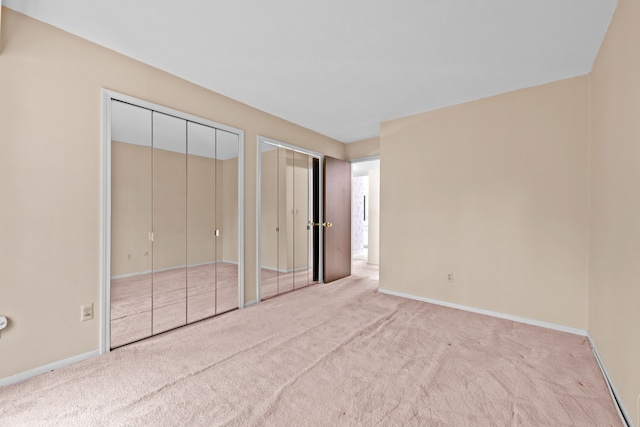 35980 Ann Arbor Trl, Livonia, MI 48150 - unfurnished bedroom with two closets, carpet, and baseboards