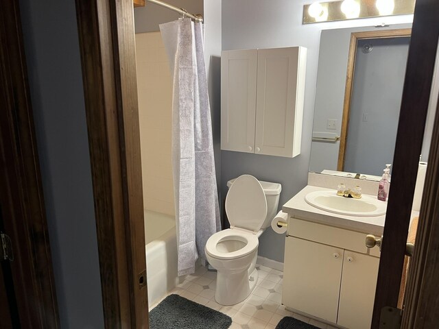 8711 M-37, Irons, MI 49644 - bathroom featuring toilet, vanity, tile patterned flooring, shower / bath combo, and baseboards