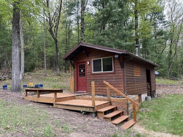 8711 M-37, Irons, MI 49644 - view of outdoor structure with an outbuilding and a forest view
