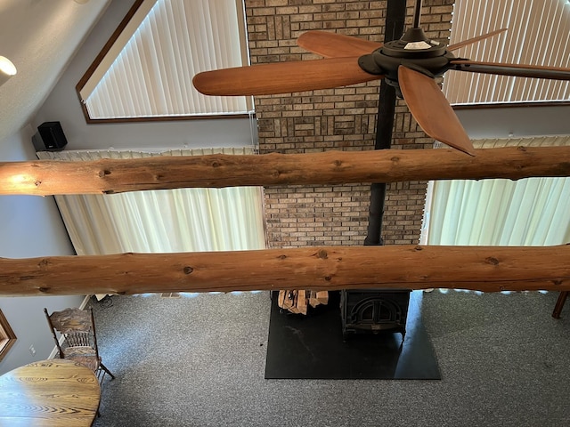 8711 M-37, Irons, MI 49644 - detailed view of a wood stove and a ceiling fan