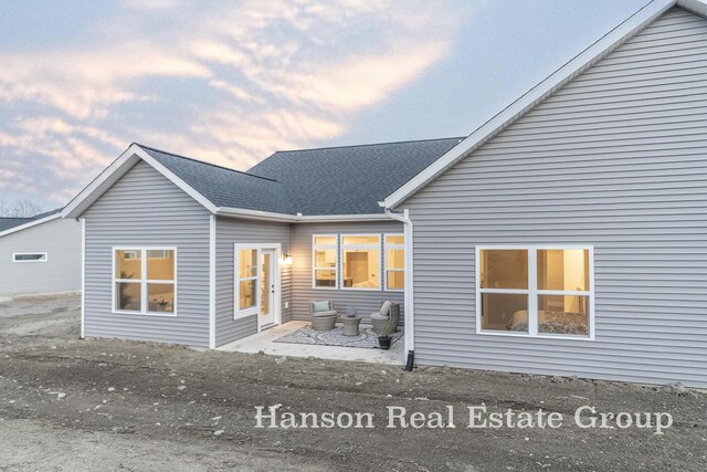 1422 Center Hill Rd SE Unit 46, Lowell, MI 49331 - rear view of property with roof with shingles