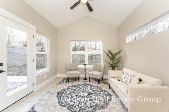 1422 Center Hill Rd SE Unit 46, Lowell, MI 49331 - sitting room featuring a ceiling fan, wood finished floors, vaulted ceiling, and baseboards