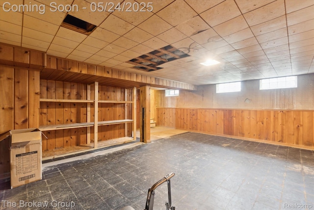 6605 Northview Dr, Clarkston, MI 48346 - below grade area featuring tile patterned floors and wood walls