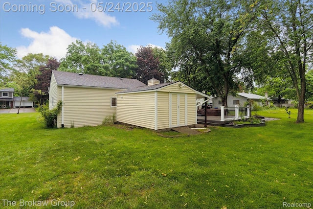6605 Northview Dr, Clarkston, MI 48346 - back of house with a lawn, a chimney, roof with shingles, and a deck
