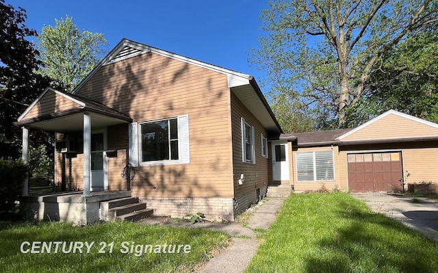 2222 Stone St, Saginaw, MI 48602 - view of front of house with a garage and concrete driveway