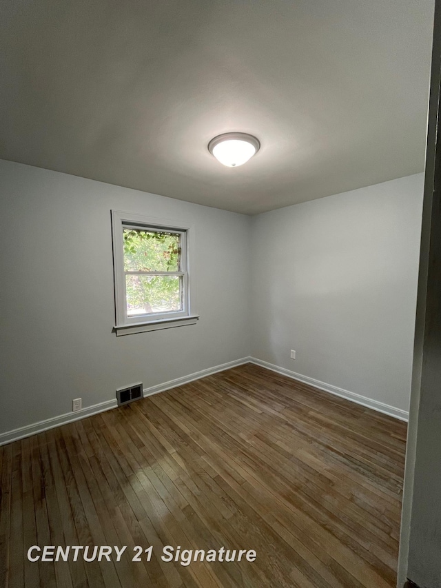 2222 Stone St, Saginaw, MI 48602 - unfurnished room featuring dark wood finished floors and baseboards