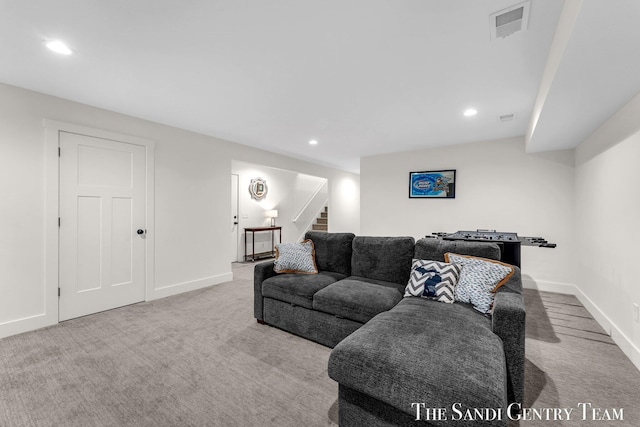 carpeted living area featuring stairs, recessed lighting, and baseboards