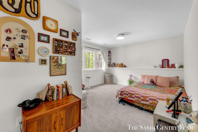 bedroom with carpet and baseboards