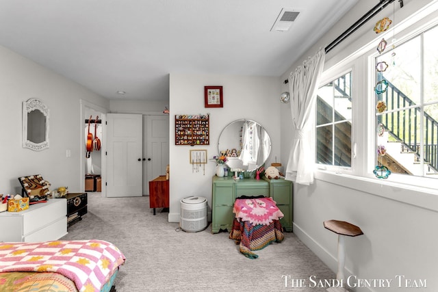 carpeted bedroom with baseboards