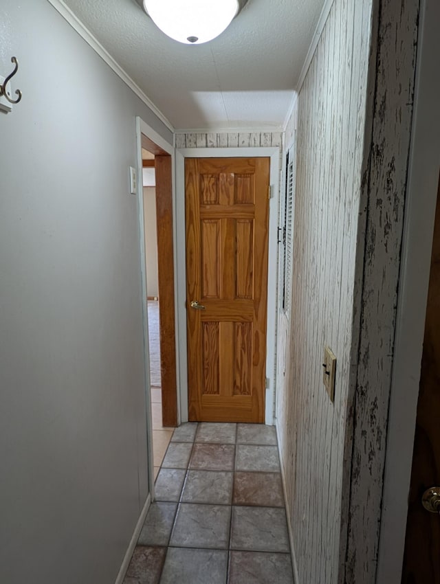 602 Fourth St, Ludington, MI 49431 - hall featuring baseboards, crown molding, and light stone finish flooring
