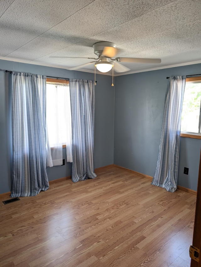 602 Fourth St, Ludington, MI 49431 - empty room featuring ceiling fan and wood finished floors