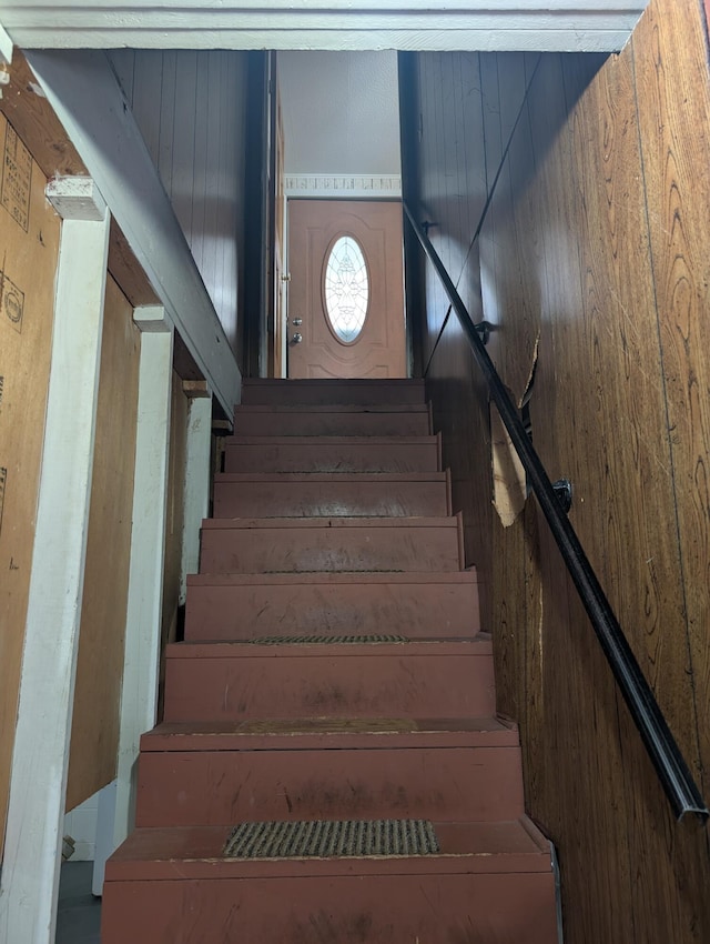602 Fourth St, Ludington, MI 49431 - stairs with wood walls