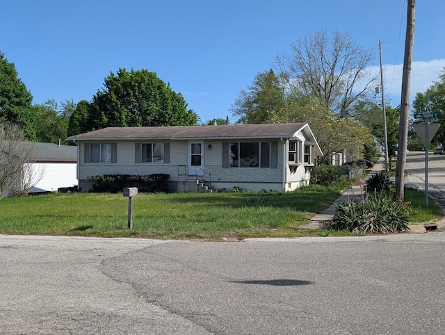 602 Fourth St, Ludington, MI 49431 - view of front of property with a front lawn