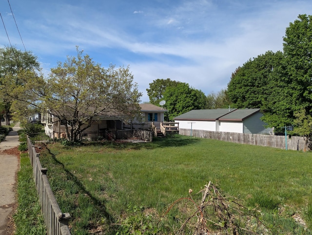 602 Fourth St, Ludington, MI 49431 - view of yard featuring a deck