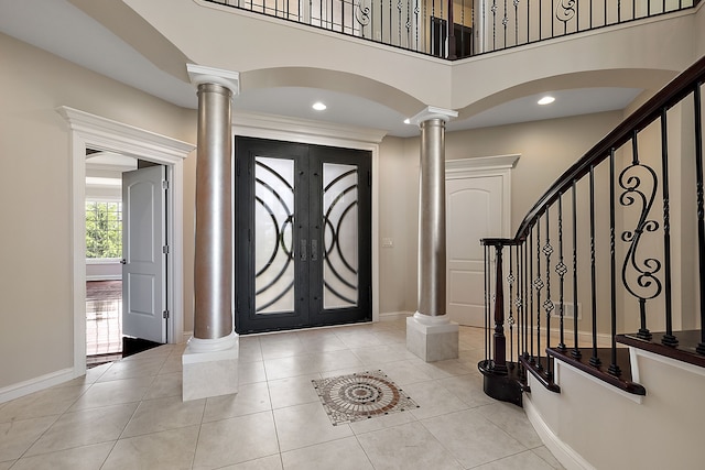 66701 Notre Dame Blvd, Washington, MI 48095 - entrance foyer featuring ornate columns, a towering ceiling, french doors, stairway, and light tile patterned flooring