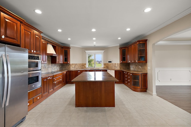 66701 Notre Dame Blvd, Washington, MI 48095 - kitchen featuring appliances with stainless steel finishes, ornamental molding, a kitchen island, recessed lighting, and backsplash