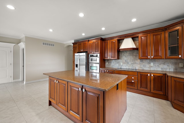66701 Notre Dame Blvd, Washington, MI 48095 - kitchen with stainless steel appliances, custom range hood, crown molding, a center island, and decorative backsplash