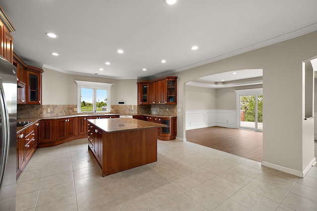 66701 Notre Dame Blvd, Washington, MI 48095 - kitchen with ornamental molding, arched walkways, a center island, tasteful backsplash, and recessed lighting